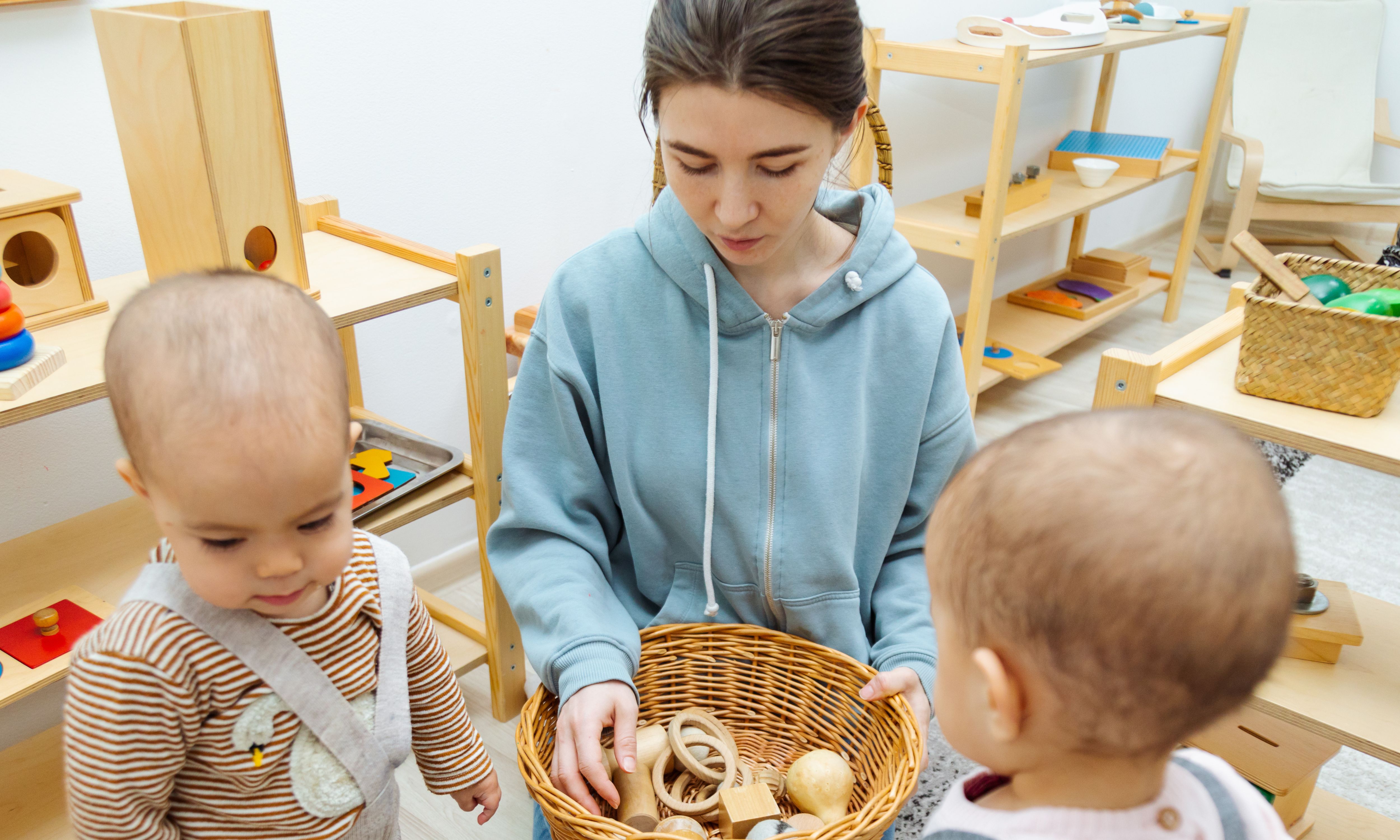 Young children interacting with early years worker 